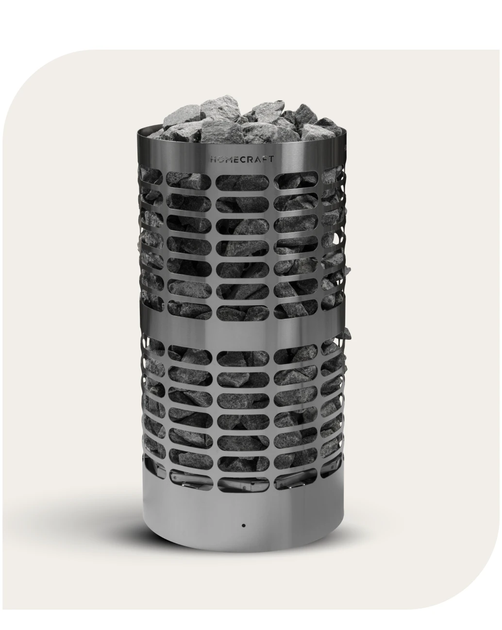 Cylindrical Homecraft sauna heater packed with grey stones on a cream background
