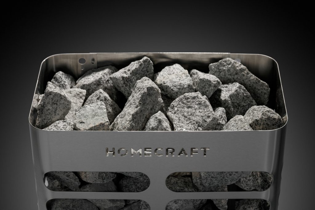Rectangular Homecraft sauna heater with wide steel louvres and stones in the top tray