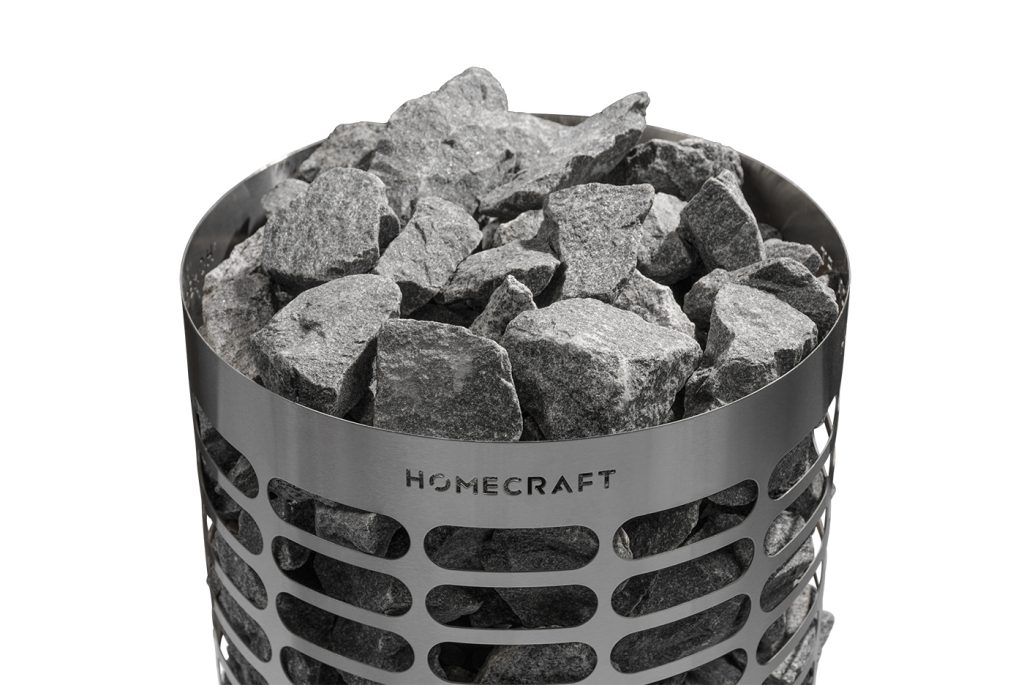 Cylindrical Homecraft sauna heater with stones above the rim and HOMECRAFT lettering