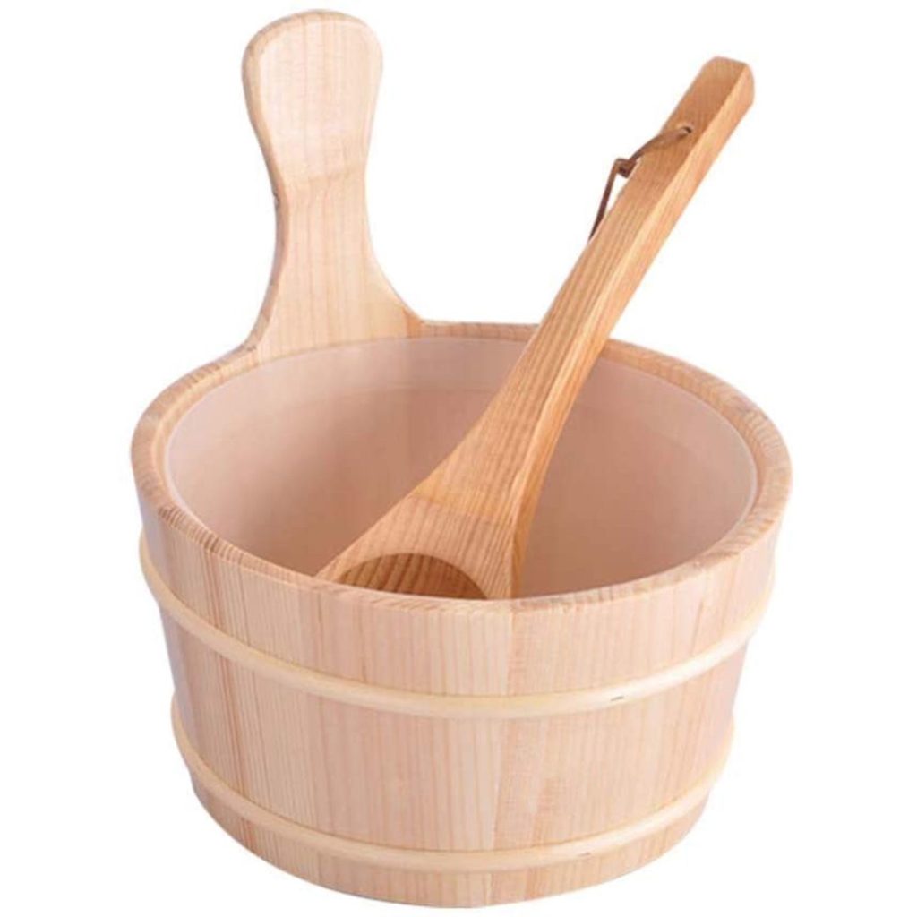 Wooden sauna bucket with a curved handle and long matching ladle resting inside
